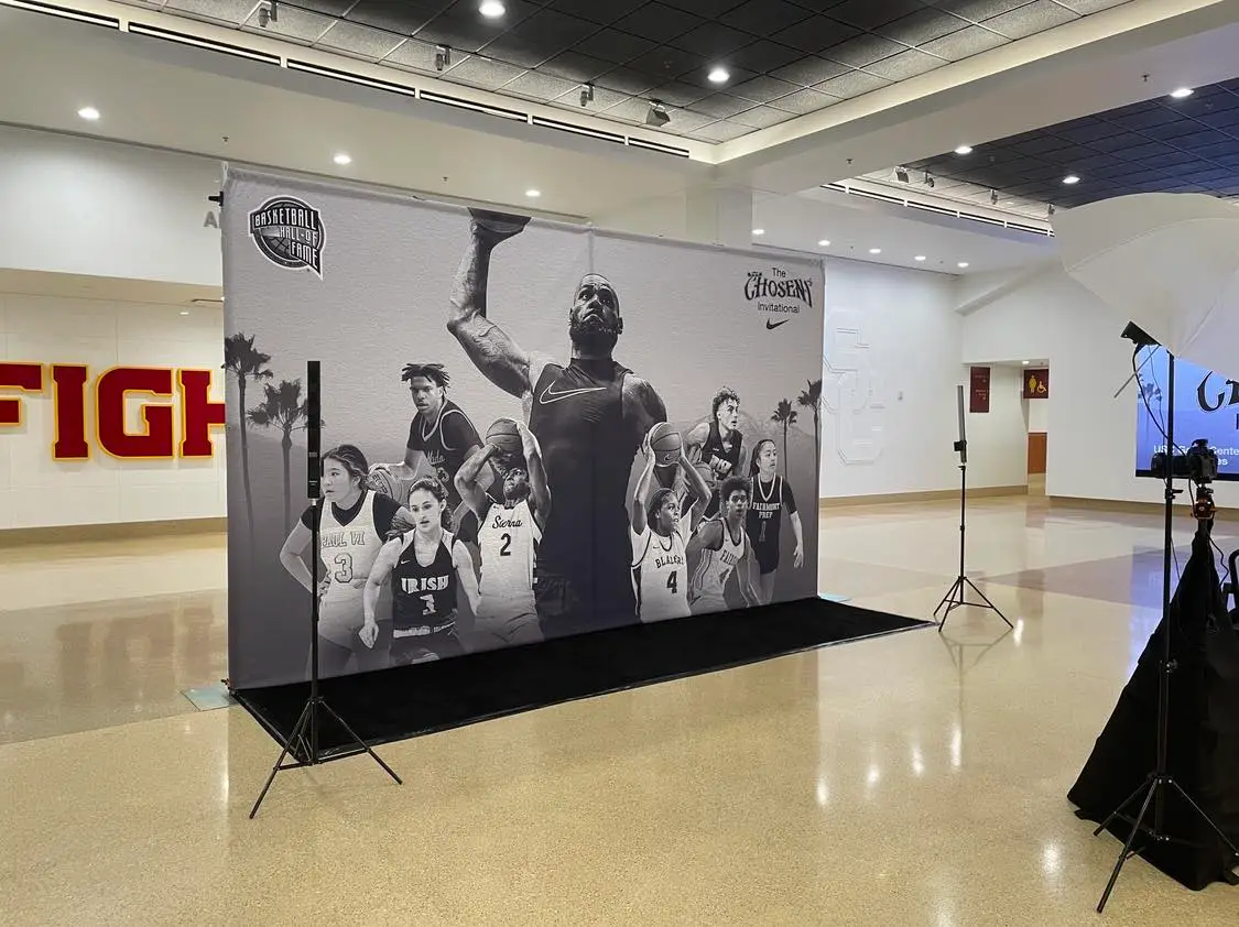 Nike event photo booth setup with large backdrop for group photos